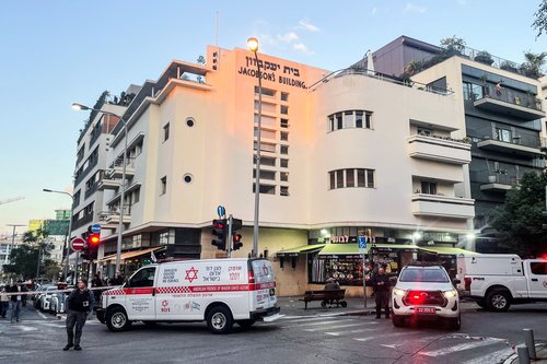 An Israeli security personnel and emergency response vehicles gather at the scene of a suspected attack in Tel Aviv