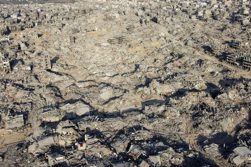 A drone view shows houses and buildings lying in ruins, following a ceasefire between Israel and Hamas, in the northern Gaza Strip