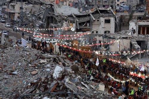 Palestinians break their fast by eating the Iftar meals during the holy month of Ramadan
