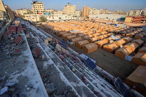 FILE PHOTO: Displaced Palestinians take shelter in a tent camp set up at Palestine Stadium, which was damaged during the Israeli offensive, in Gaza City