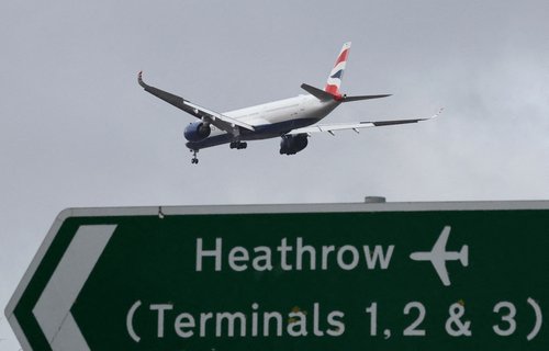 FILE PHOTO: Planes make landing approach to Heathrow Airport in west London
