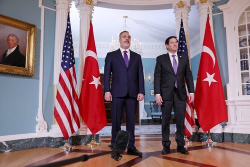 U.S. Secretary of State Rubio poses for members of the news media with Turkish Foreign Minister Fidan at the State Department in Washington