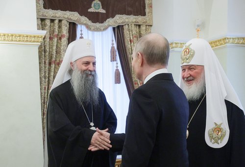 Russian President Vladimir Putin welcomes Serbian Patriarch Porfirije in Moscow