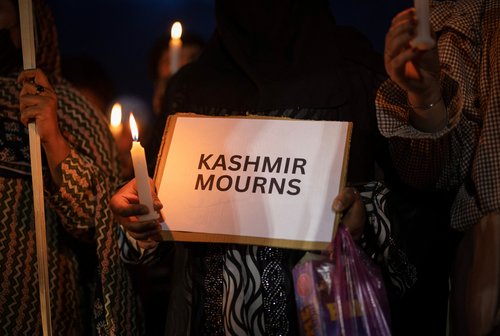Demonstrators hold a candle light vigil to condemn a suspected militant attack on tourists near south Kashmir’s scenic Pahalgam, in Srinagar