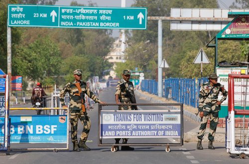 Border Security Force (BSF) security personnel stand guard at the Attari-Wagah crossing on the India-Pakistan border in Amritsar