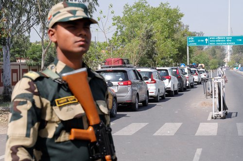 A Border Security Force (BSF) security personnel stands guard at the Attari-Wagah crossing on the India-Pakistan border near Amritsar
