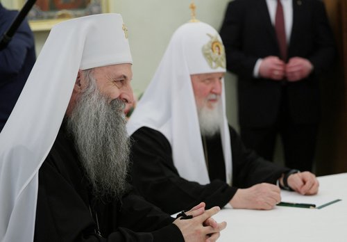Russian President Vladimir Putin welcomes Serbian Patriarch Porfirije in Moscow