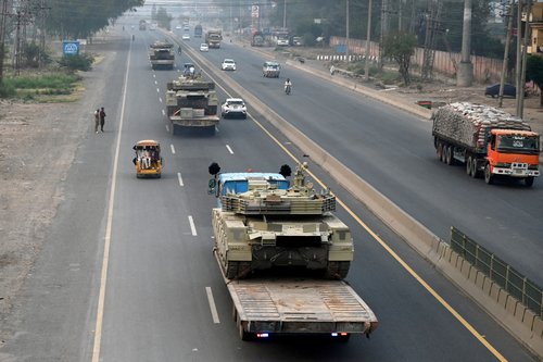 Tanks are transported on a road in Muridke near Lahore, Pakistan