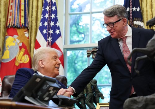 U.S. President Donald Trump shakes hands with U.S. Ambassador to the United Kingdom Warren Stephens after announcing a trade deal with the U.K.