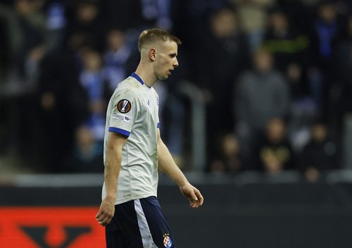 Soccer Football - UEFA Europa League - Play Off - Second Leg - KRC Genk v GNK Dinamo Zagreb - Cegeka Arena, Genk, Belgium - February 26, 2026 GNK Dinamo Zagreb's Luka Stojkovic looks dejected as he leaves the pitch after receiving a red card REUTERS/Mauri