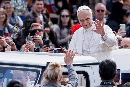 Pope Leo XIV waves as he leaves after Palm Sunday Mass in Saint Peter's Square at the Vatican, March 29, 2026. REUTERS/Remo Casilli