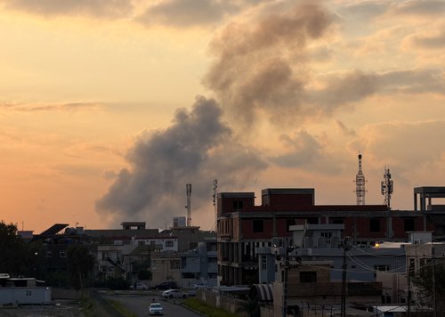 Smoke rises following an airstrike on a Popular Mobilization Forces (PMF) headquarters at Kirkuk International Airport, in Kirkuk, Iraq, March 28, 2026. REUTERS/Ako Rasheed