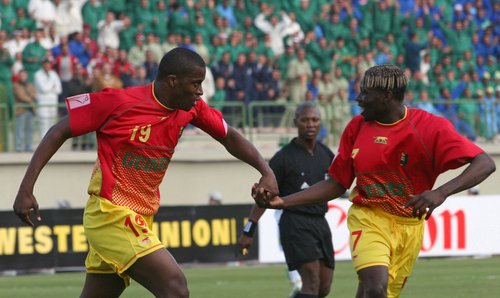 FILE PHOTO: Guinea's Diawara celebrates his goal with team mate Mansare during African Nations Cup in Egypt