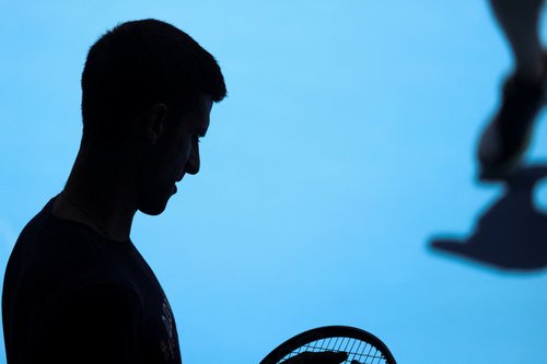 Serbian tennis player Novak Djokovic practices at Melbourne Park as questions remain over the legal battle regarding his visa to play in the Australian Open