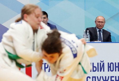 FILE PHOTO: Russian President Putin attends a youth judo tournament in St. Petersburg