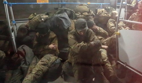 Buses carrying Ukrainian Azovstal service members arrive in Olenivka