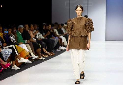 Models present creations at the SA Fashion Week