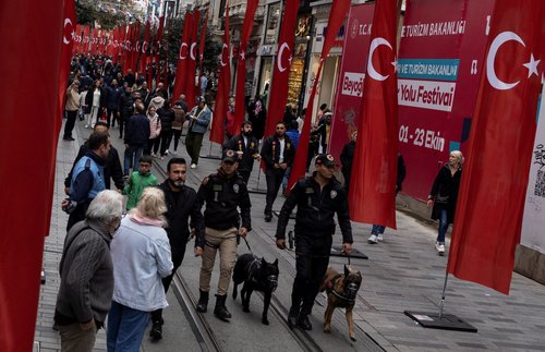 People walk along Istiklal Avenue in Istanbul