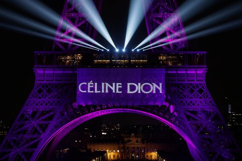 The Eiffel Tower lights up to mark the announcement of concert dates and ticket sales for singer Celine Dion's upcoming ten concerts in September and October in Paris, France, March 30, 2026. REUTERS/Benoit Tessier