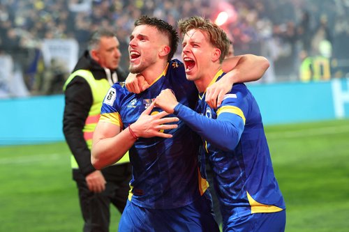 Soccer Football - FIFA World Cup - UEFA Qualifiers - Finals - Bosnia and Herzegovina v Italy - Bilino Polje Stadium, Zenica, Bosnia and Herzegovina - March 31, 2026 Bosnia and Herzegovina's Ermedin Demirovic and Dzenis Burnic celebrate qualifying for the