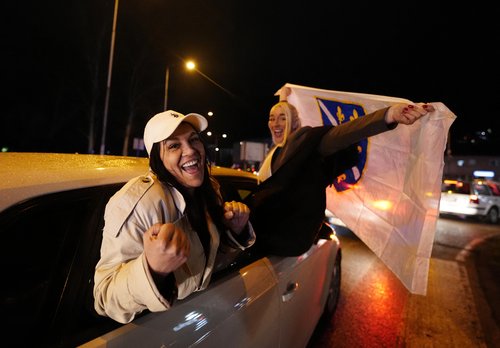 Soccer Football - FIFA World Cup - UEFA Qualifiers - Finals - Bosnia and Herzegovina v Italy - Zenica, Bosnia and Herzegovina - April 1, 2026 Bosnia and Herzegovina fans celebrate out of a car after qualifying for the FIFA World Cup outside the stadium RE