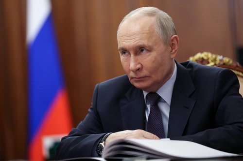 Russian President Vladimir Putin attends a meeting with Head of the Roscosmos space corporation Dmitry Bakanov at the Kremlin in Moscow