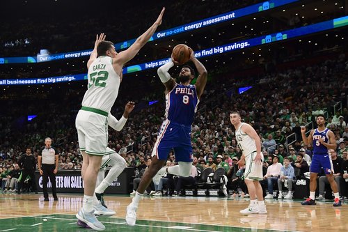Apr 19, 2026; Boston, Massachusetts, USA; Philadelphia 76ers forward Paul George (8) gets fouled by Boston Celtics center Luka Garza (52) in the first half during game one of the first round of the 2026 NBA Playoffs at TD Garden. Mandatory Credit: Bob DeC