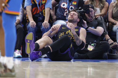 Apr 2, 2026; Oklahoma City, Oklahoma, USA; Los Angeles Lakers guard Luka Doncic (77) falls to the court during a play against the Oklahoma City Thunder during the third quarter at Paycom Center. Mandatory Credit: Alonzo Adams-Imagn Images
