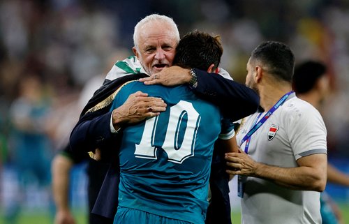 FILE PHOTO: Soccer Football - FIFA World Cup - Inter-Confederation Playoffs - Final - Iraq v Bolivia - Estadio Monterrey, Monterrey, Mexico - March 31, 2026 Iraq coach Graham Arnold celebrates with Mohanad Ali after qualifying for FIFA World Cup REUTERS/D