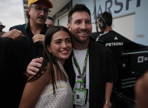 Formula One F1 - Miami Grand Prix - Miami International Autodrome, Miami, Florida, United States - May 3, 2026 Footballer Lionel Messi takes a selfie with Maia Reficco, actress and girlfriend of Alpine's Franco Colapinto in the pit lane ahead of the grand