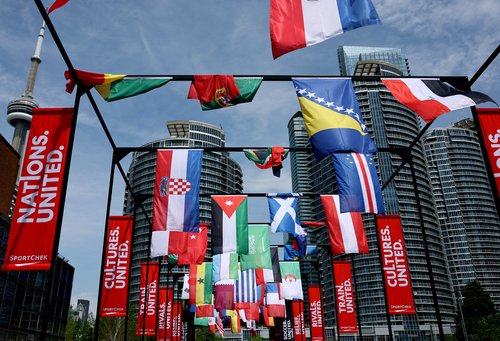 Soccer Football - FIFA World Cup 2026 - Toronto Harbour, Toronto, Canada - June 11, 2026 The flags of participating countries are pictured at the fan zone on the Toronto harbourfront as the CN Tower is seen in the background REUTERS/Bernadett Szabo