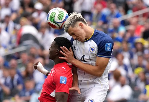 Soccer Football - FIFA World Cup 2026 - Group B - Switzerland v Bosnia and Herzegovina - Los Angeles Stadium, Inglewood, California, U.S. - June 18, 2026 Switzerland's Breel Embolo in action with Bosnia and Herzegovina's Tarik Muharemovic IMAGN IMAGES via
