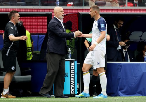 Soccer - FIFA World Cup 2026 - Group B - Switzerland v Bosnia and Herzegovina - Los Angeles Stadium, Inglewood, California, U.S. - June 18, 2026 Bosnia and Herzegovina's Edin Dzeko shakes with coach Sergej Barbarez after being substituted IMAGN IMAGES via
