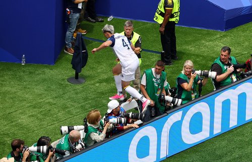 Soccer Football - FIFA World Cup 2026 - Group B - Switzerland v Bosnia and Herzegovina - Los Angeles Stadium, Inglewood, California, U.S. - June 18, 2026 Bosnia and Herzegovina's Tarik Muharemovic jumps over the advertising boards past photographers after