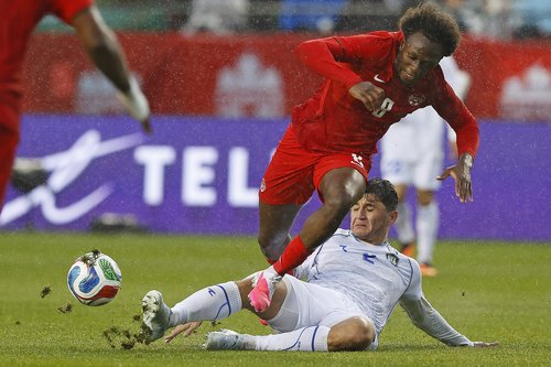 Jun 1, 2026; Edmonton, Ontario, CAN; Team Canada midfielder Ismael Kone (8) is tackled by Uzbekistan defender Abdukodir Khusanov (2) during there first half at Commonwealth Stadium. Mandatory Credit: Perry Nelson-Imagn Images