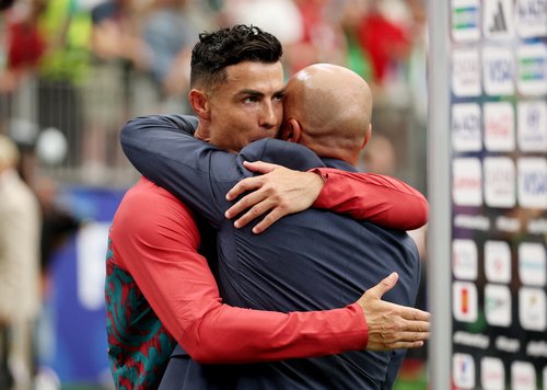 Soccer Football - FIFA World Cup 2026 - Group K - Portugal v Uzbekistan - Houston Stadium, Houston, Texas, U.S. - June 23, 2026 Portugal's Cristiano Ronaldo and coach Roberto Martinez celebrate after the match REUTERS/Phil Noble