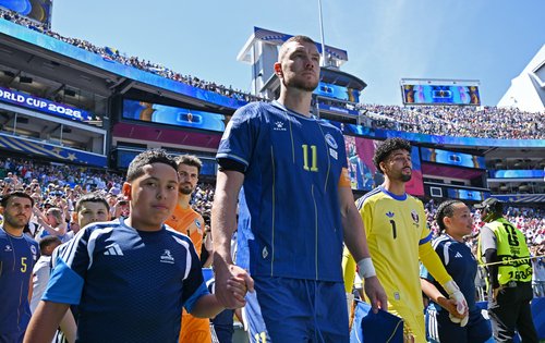 Soccer Football - FIFA World Cup 2026 - Group B - Bosnia and Herzegovina v Qatar - Seattle Stadium, Seattle, Washington, U.S. - June 24, 2026 Bosnia and Herzegovina's Edin Dzeko and Qatar's Mahmoud Abunada walk onto the pitch before the match IMAGN IMAGES