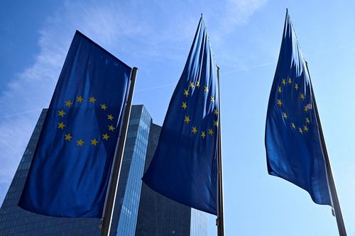 FILE PHOTO: FILE PHOTO: European Union flags flutter outside the European Central Bank (ECB) headquarters in Frankfurt, Germany, March 19, 2026. REUTERS/Jana Rodenbusch/File Photo