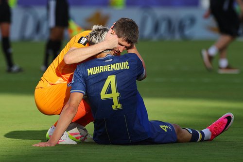 Soccer Football - FIFA World Cup 2026 - Round of 32 - United States v Bosnia and Herzegovina - San Francisco Bay Area Stadium, Santa Clara, California, U.S. - July 1, 2026 Bosnia and Herzegovina's Tarik Muharemovic is consoled by Nikola Vasilj after the m