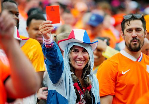 Soccer Football - FIFA World Cup 2026 - Group F - Tunisia v Netherlands - Kansas City Stadium, Kansas City, Missouri, U.S. - June 25, 2026 A Netherlands fan holds a red card inside the stadium before the match IMAGN IMAGES via Reuters/Jay Biggerstaff