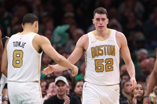 Apr 12, 2026; Boston, Massachusetts, USA; Boston Celtics forward Luka Garza (52) celebrates with Boston Celtics guard John Tonje (8) during the first half at TD Garden. Mandatory Credit: Paul Rutherford-Imagn Images