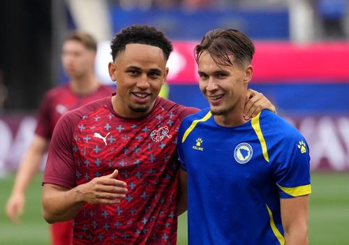 Soccer Football - FIFA World Cup 2026 - Group B - Switzerland v Bosnia and Herzegovina - Los Angeles Stadium, Inglewood, California, U.S. - June 18, 2026 Switzerland's Noah Okafor and Bosnia and Herzegovina's Amar Dedic before the match IMAGN IMAGES via R