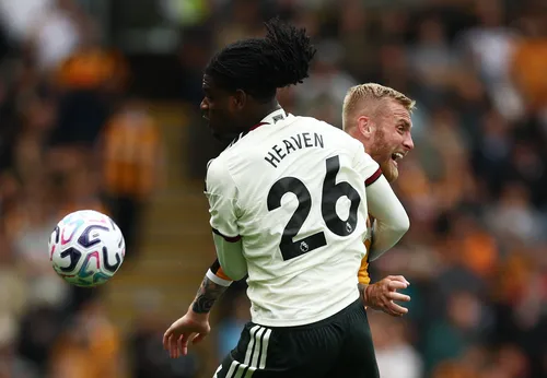 Soccer Football - Premier League - Hull City v Manchester United - MKM Stadium, Hull, Britain - August 22, 2026 Manchester United's Ayden Heaven in action with Hull City's Oli McBurnie Action Images via Reuters/Lee Smith EDITORIAL USE ONLY. NO USE WITH UN