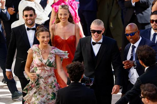 Manchester City forward Erling Haaland and his partner Isabel Haugseng Johansen arrive for the wedding of his teammate Manchester City goalkeeper Gianluigi Donnarumma and Alessia Elefante at the Chiesa Madre di San Giorgio Martire in Locorotondo, Italy, J