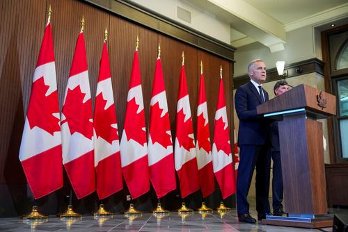 Canada’s Prime Minister Mark Carney speaks with the news media after he suspended trade negotiations with the United States, in Ottawa, Ontario, Canada August 22, 2026. REUTERS/Chris Tanouye