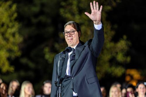 Serbian President Aleksandar Vucic waves to citizens outside the Presidency of Serbia moments before formally submitting his resignation, ending his second and final five-year term in office, in Belgrade