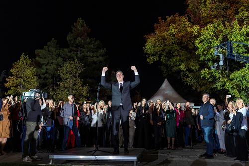 Serbian President Aleksandar Vucic waves to citizens outside the Presidency of Serbia
