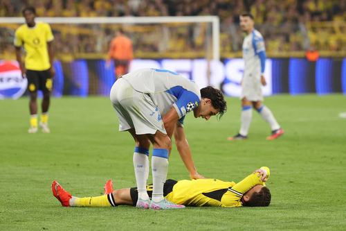 Soccer Football - UEFA Champions League - Borussia Dortmund v Villarreal - Signal Iduna Park, Dortmund, Germany - September 8, 2026 Borussia Dortmund's Konstantinos Karetsas reacts after sustaining an injury as Villarreal's Sergi Cardona looks on REUTERS/