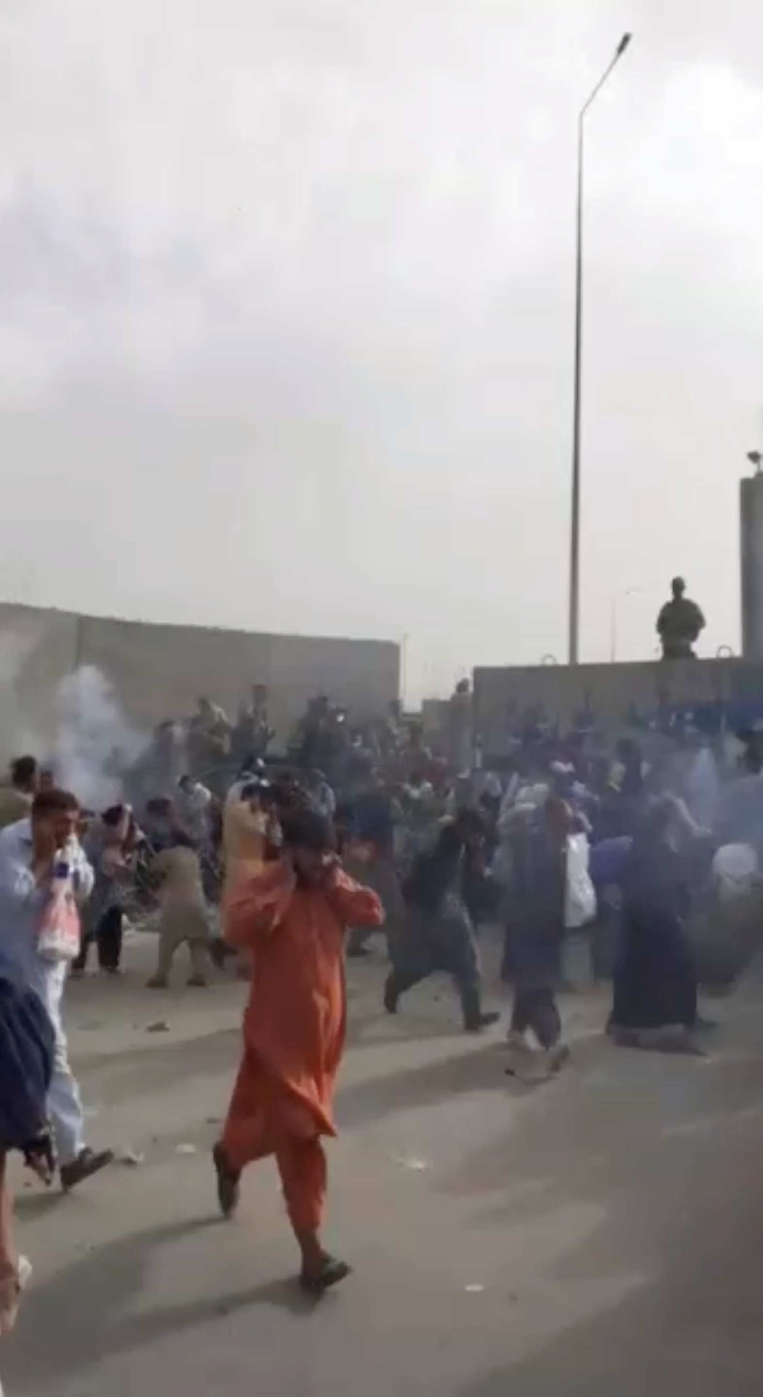 People run from gunfire at Kabul airport