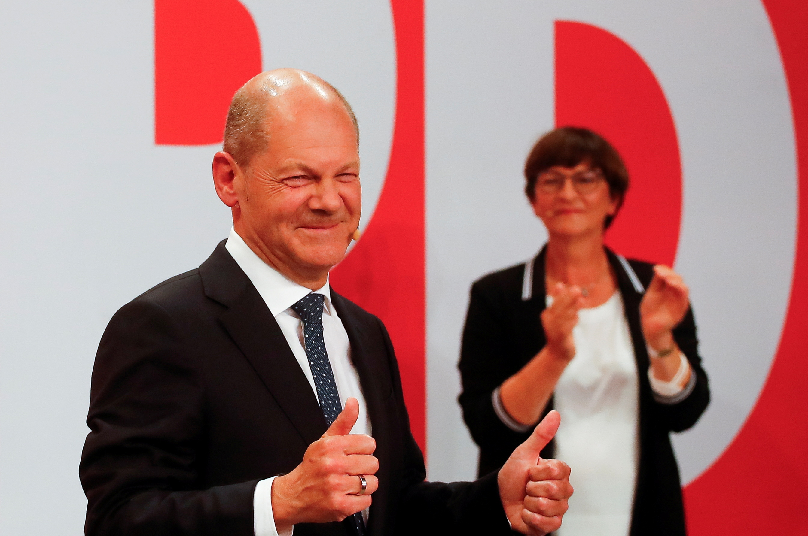 Reactions to the first exit polls from Social Democratic Party candidate Olaf Scholz and supporters at the party headquarters